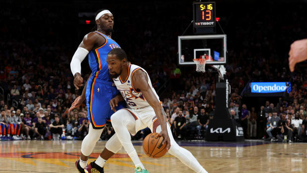 Nov 12, 2023; Phoenix, Arizona, USA; Phoenix Suns forward Kevin Durant (35) drives to the net against Oklahoma City Thunder guard Luguentz Dort (5) during the first quarter at Footprint Center.